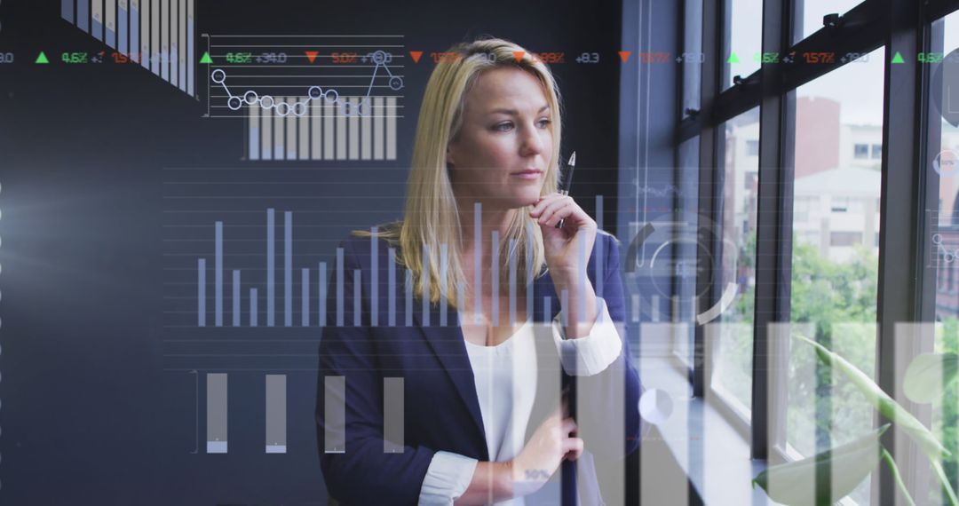 Businesswoman Analyzing Financial Data with Advanced Digital Graphics