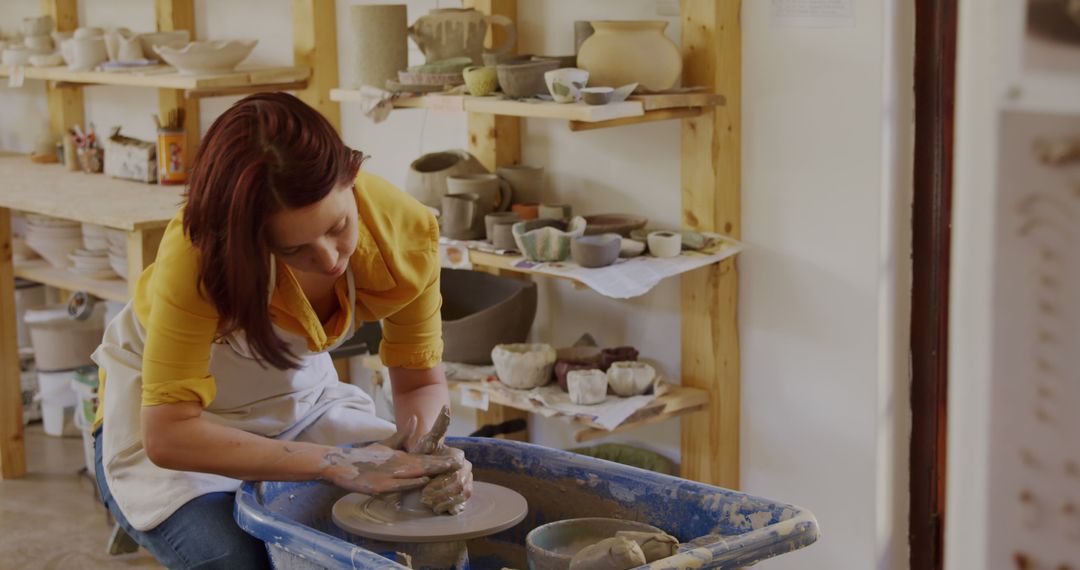 Female Potter Creating Pottery on Wheel in Artisan Workshop - Free Images, Stock Photos and Pictures on Pikwizard.com