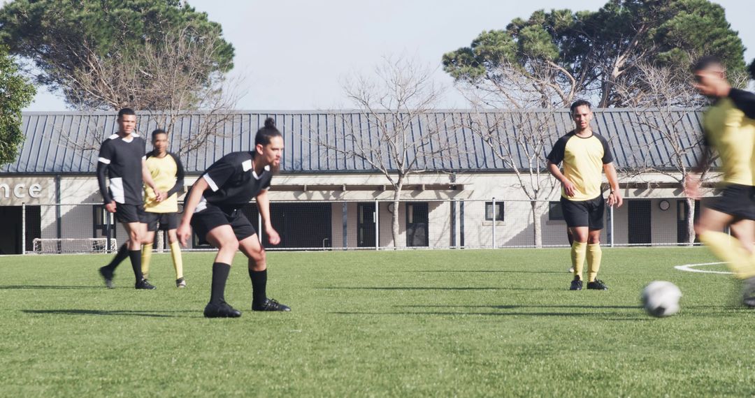 Competitive Team Soccer Practice on Field Under Clear Sky