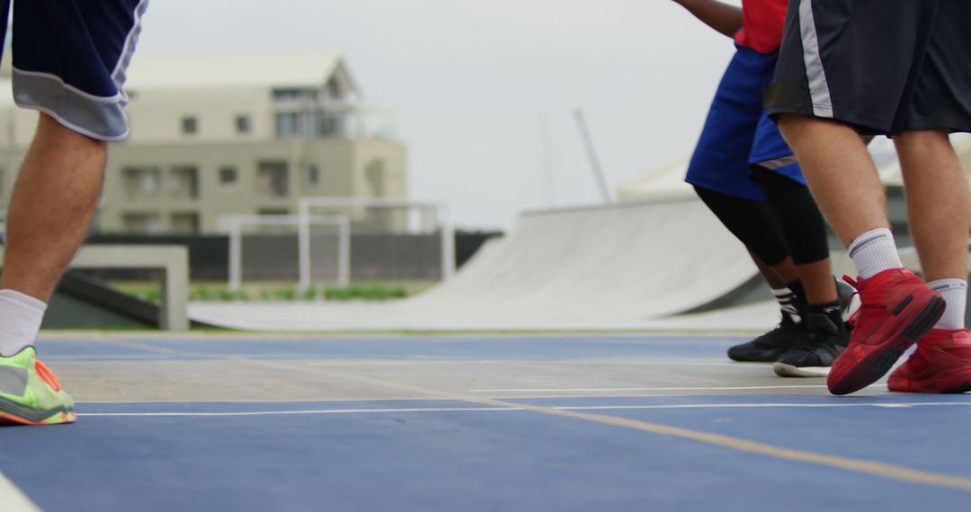 Legs of Active Basketball Players on an Outdoor Court - Free Images, Stock Photos and Pictures on Pikwizard.com