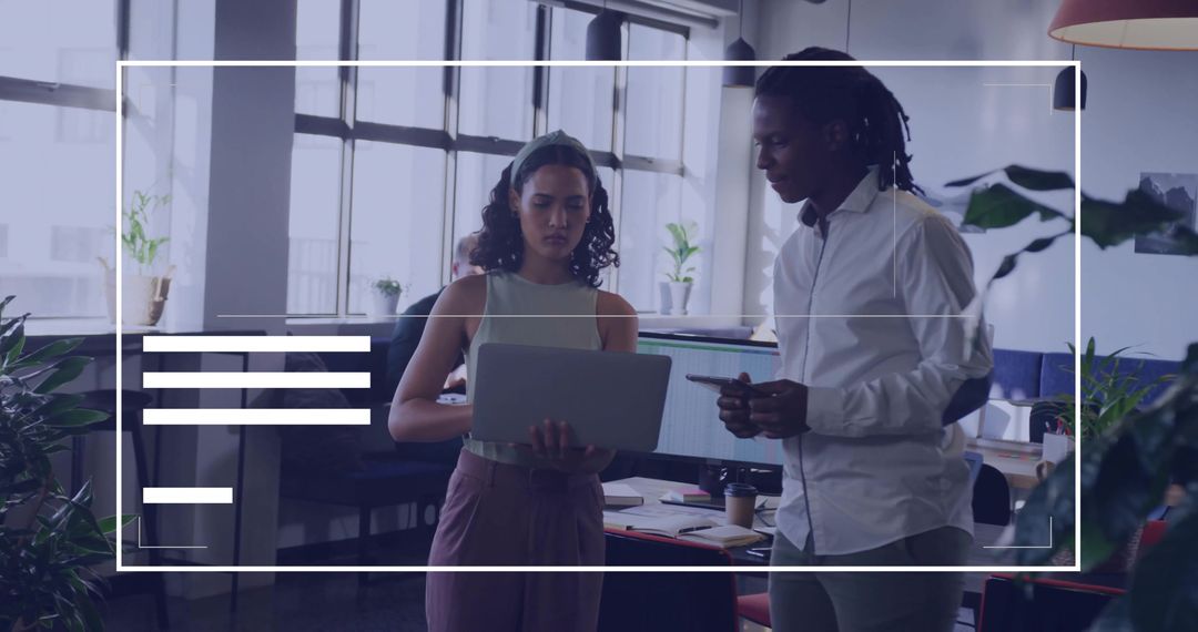 Collaborating Professionals Discussing Project on Laptop in Modern Office