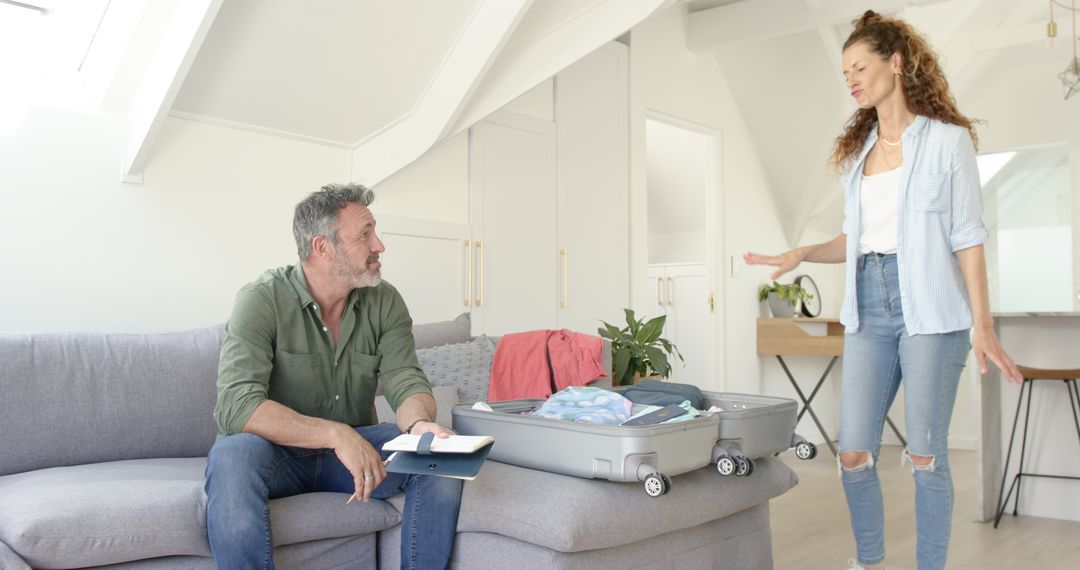 Couple Packing Luggage Together with Anticipation of Vacation Journey