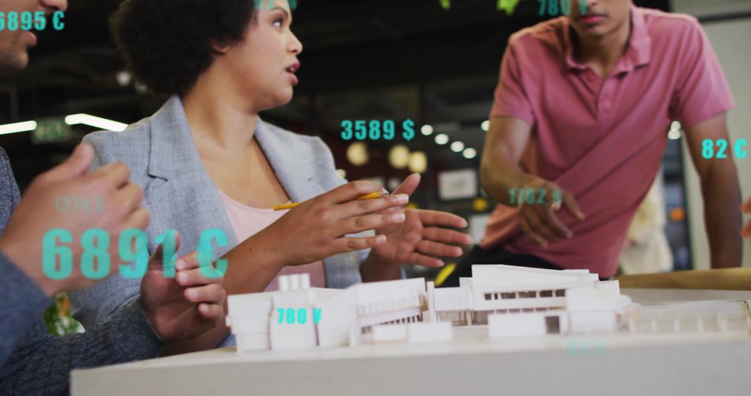 Diverse Team Collaborating on Architectural Project with Digital Data