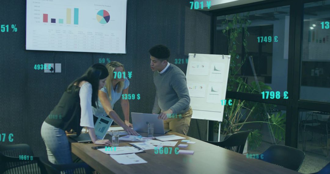 Team Analyzing Financial Data with AR Currency Symbols in Modern Office