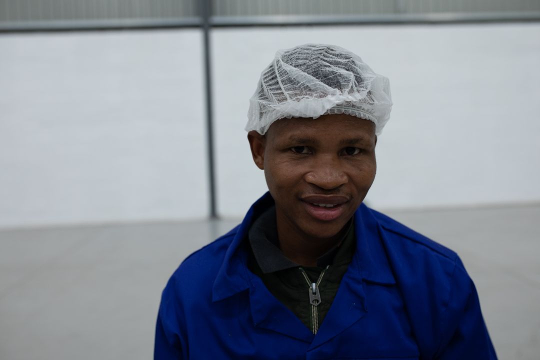 African American Male Factory Worker Smiling in Workshop - Free Images, Stock Photos and Pictures on Pikwizard.com