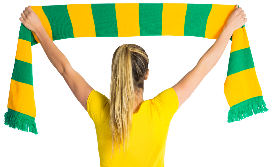 Woman holding green and yellow football scarf, showing support, arms raised in celebration - Download Free Stock Images Pikwizard.com