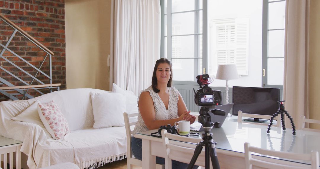 Woman Recording Video at Home in Bright Living Room - Free Images, Stock Photos and Pictures on Pikwizard.com