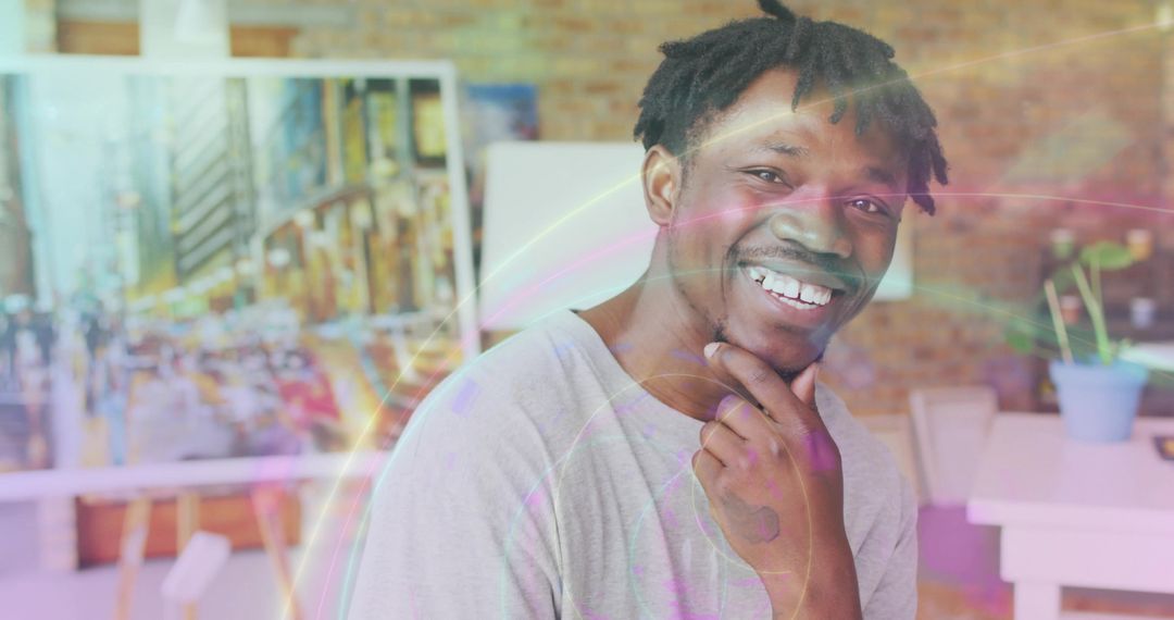 Creative Artist Smiling in loft studio with Cityscape Art