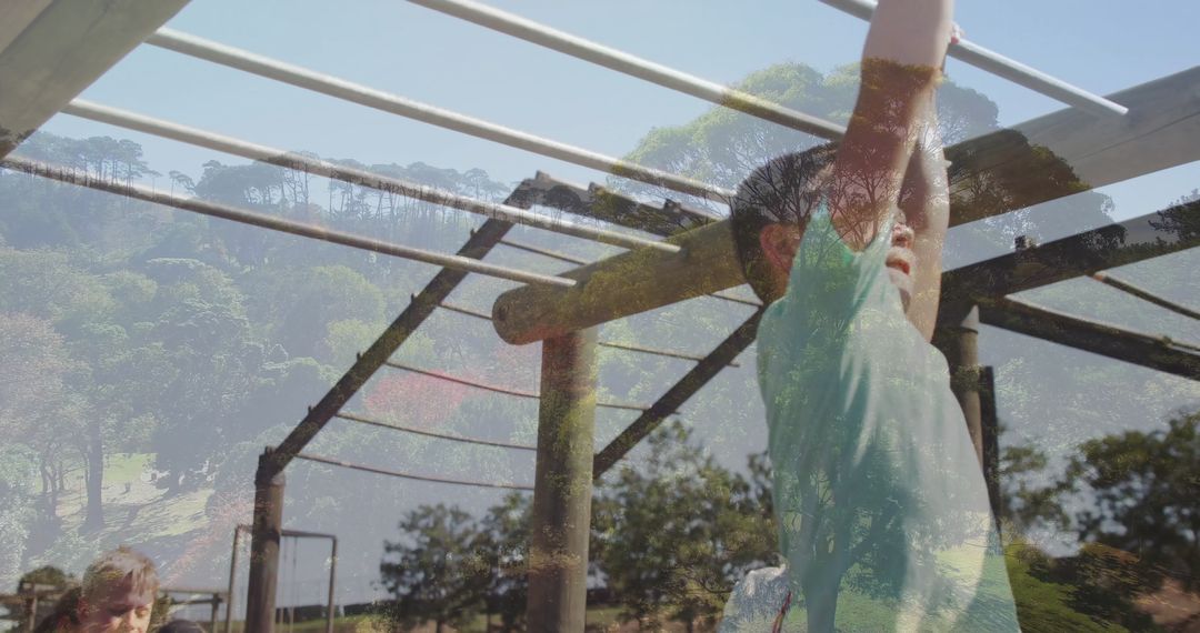Child Playing on Monkey Bars with Adult Supervision in Park