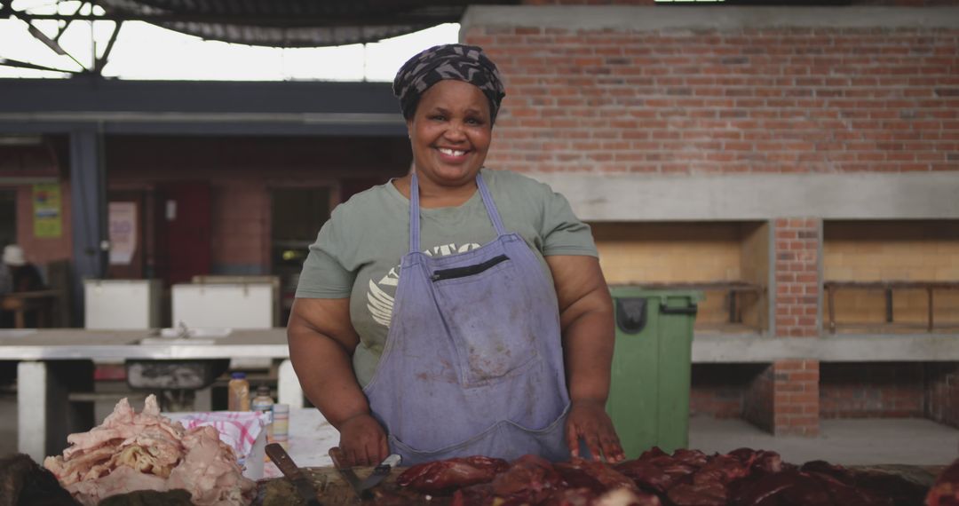 Smiling Butcher Woman Standing at Meat Market Stall - Free Images, Stock Photos and Pictures on Pikwizard.com