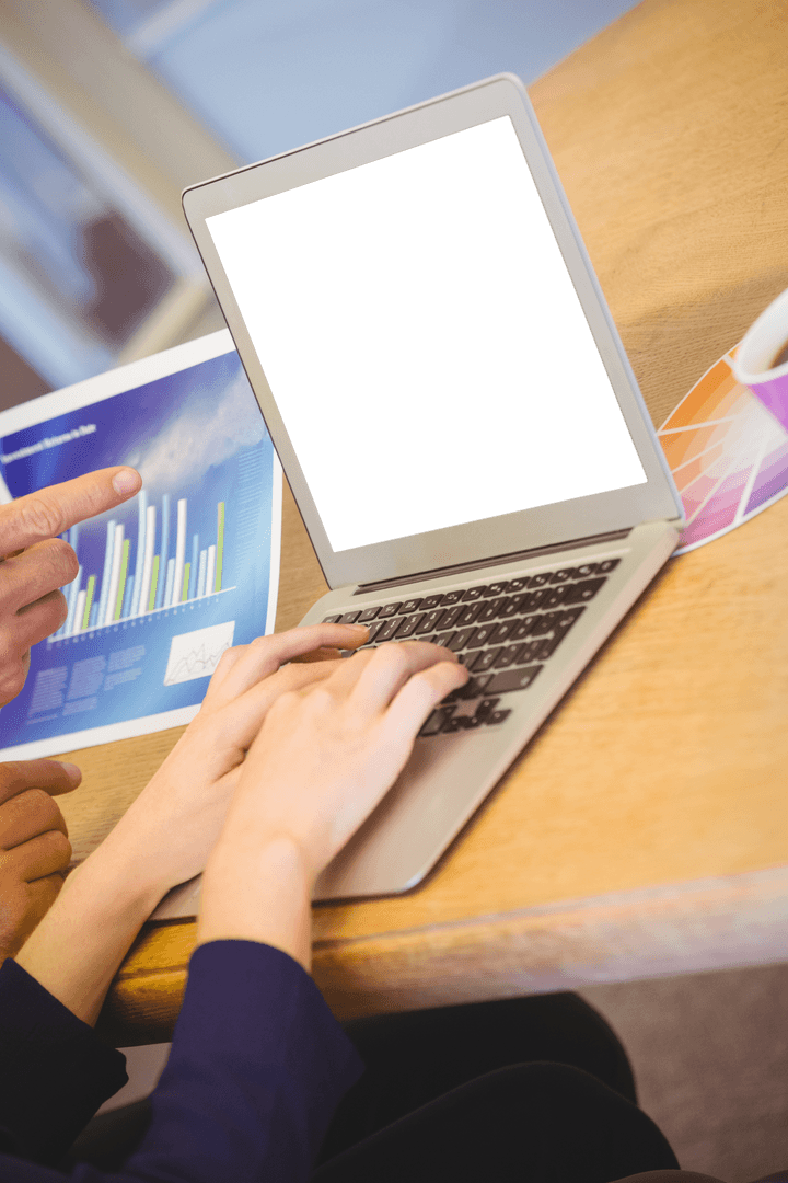 Transparent Laptop Screen in Office with Colleagues Collaborating