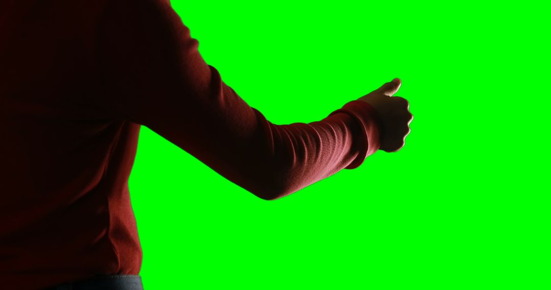 Person Giving Thumbs Up Gesture Against Green Screen - Free Images, Stock Photos and Pictures on Pikwizard.com