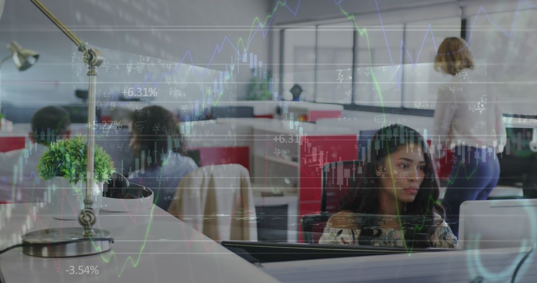 Technology and Teamwork in Modern Office with Financial Data Overlay