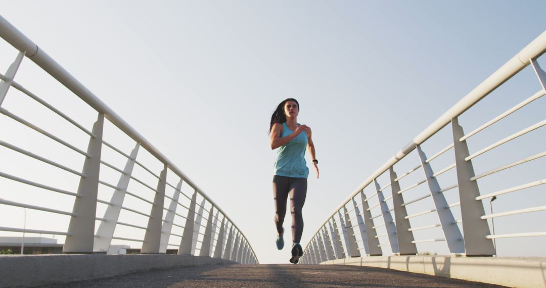 Young Woman Running on Bridge for Exercise and Fitness - Free Images, Stock Photos and Pictures on Pikwizard.com