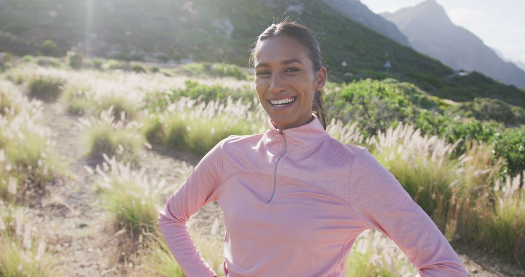 Smiling Woman in Activewear Enjoying Outdoor Trail - Free Images, Stock Photos and Pictures on Pikwizard.com