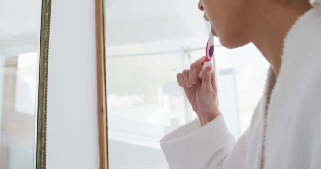 Person Brushing Teeth in Front of Mirror - Free Images, Stock Photos and Pictures on Pikwizard.com