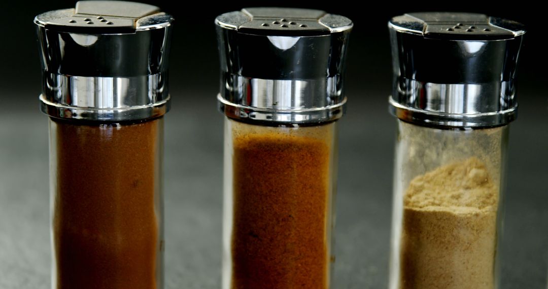 Close Up of Assorted Spice Jars on Black Background - Free Images, Stock Photos and Pictures on Pikwizard.com