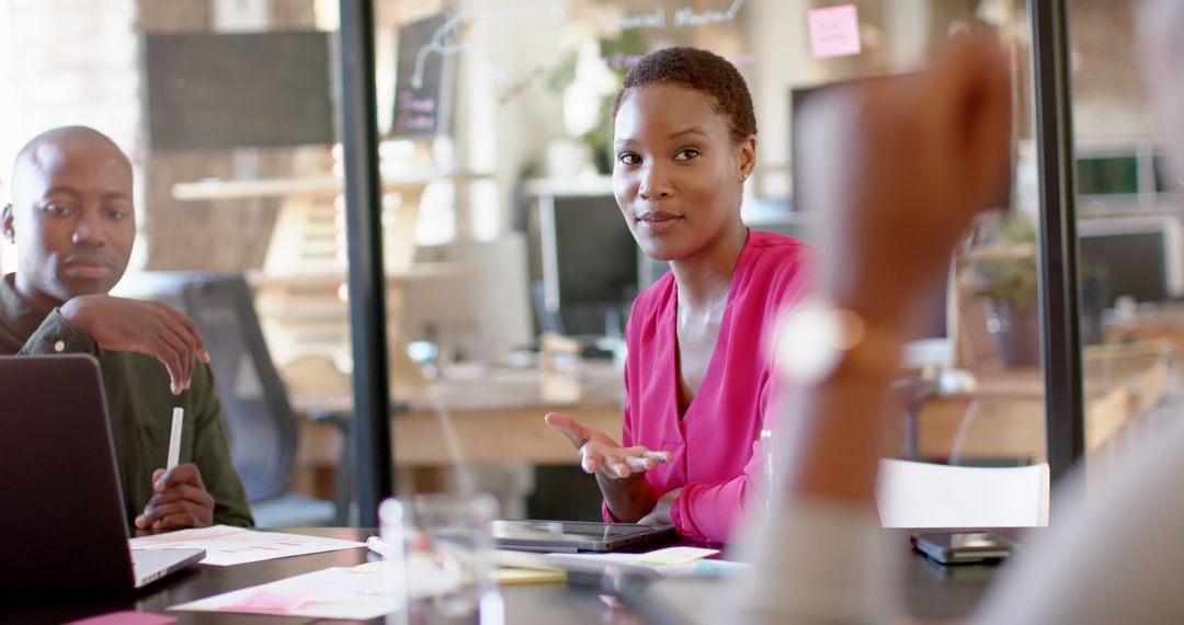 Professionals Collaborating in Modern Office Meeting