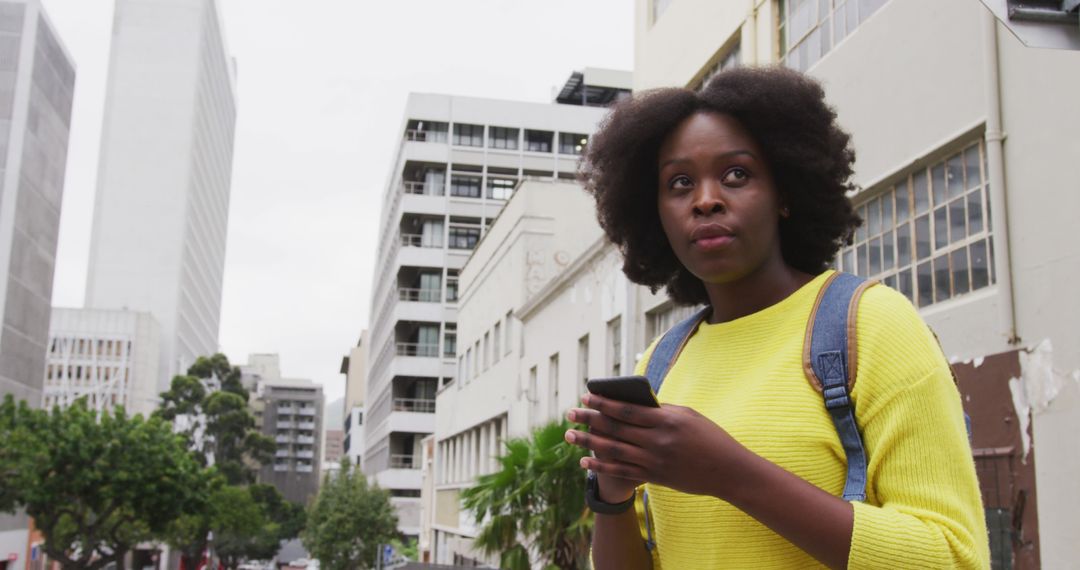 Young African American Woman Using Smartphone in City - Free Images, Stock Photos and Pictures on Pikwizard.com