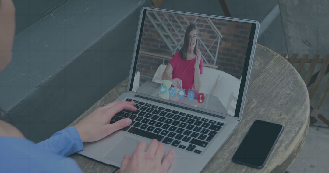 Virtual Business Meeting with Financial Data on Laptop