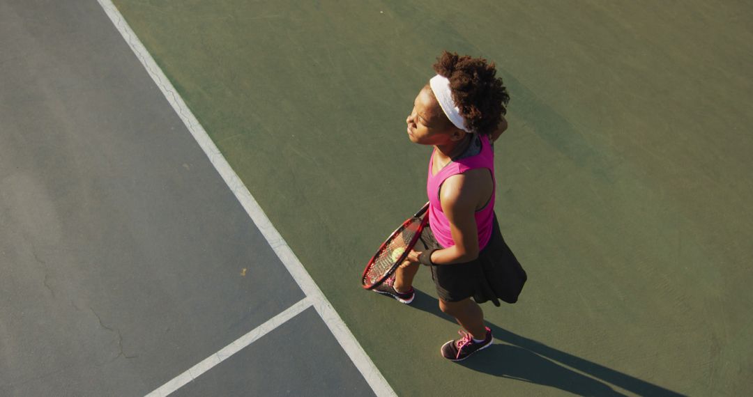 Young Female Tennis Player on Court in Summer Outfit - Free Images, Stock Photos and Pictures on Pikwizard.com