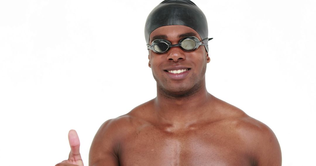 Confident Male Swimmer Giving Thumbs Up - Free Images, Stock Photos and Pictures on Pikwizard.com