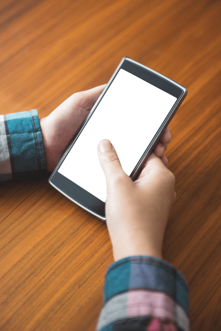 Transparent Phone Screen Held Above Wooden Table
