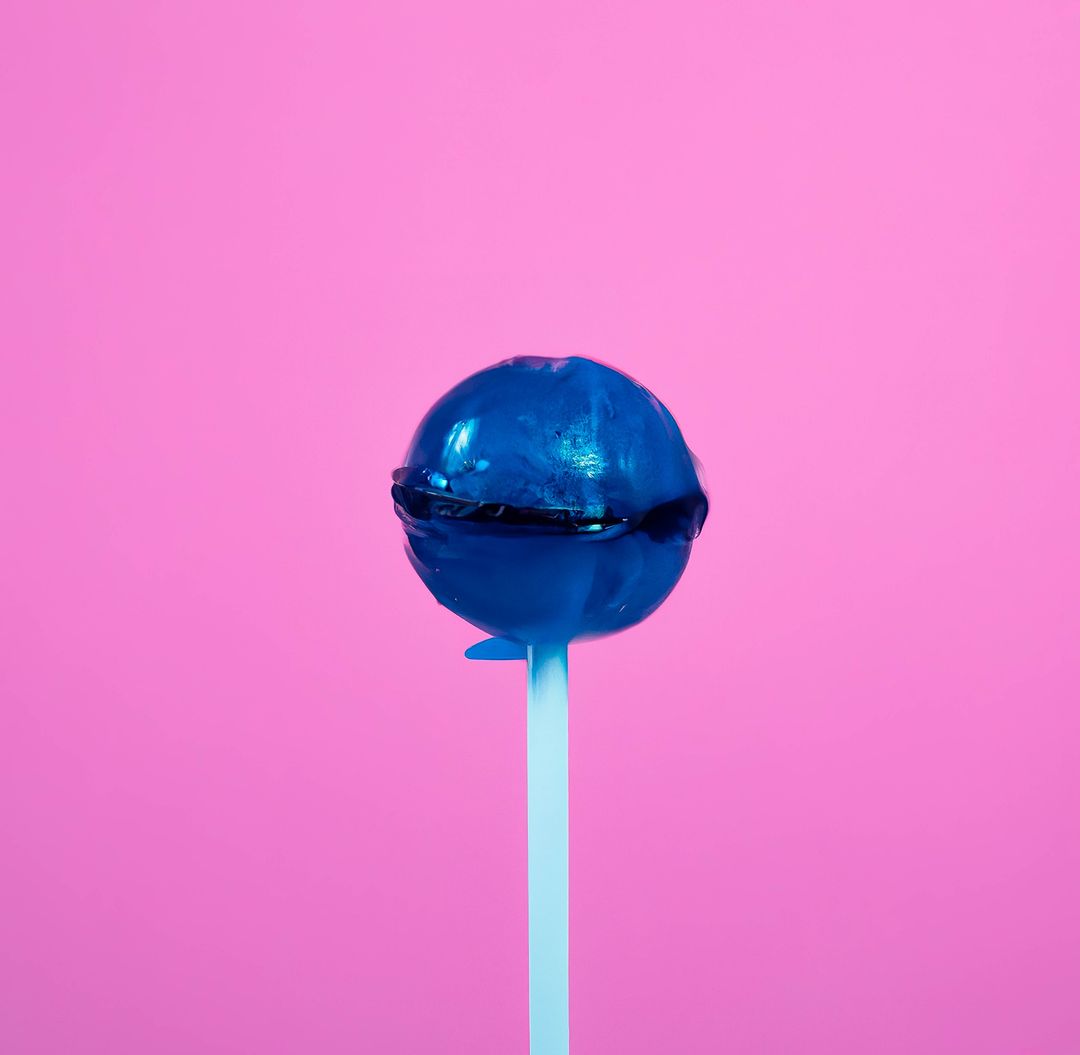 Blue lollipop against vibrant pink background - Free Images, Stock Photos and Pictures on Pikwizard.com