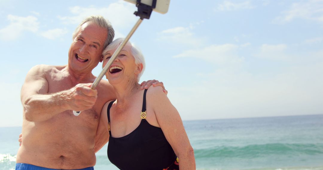 Happy Senior Couple Taking Selfie on the Beach - Free Images, Stock Photos and Pictures on Pikwizard.com