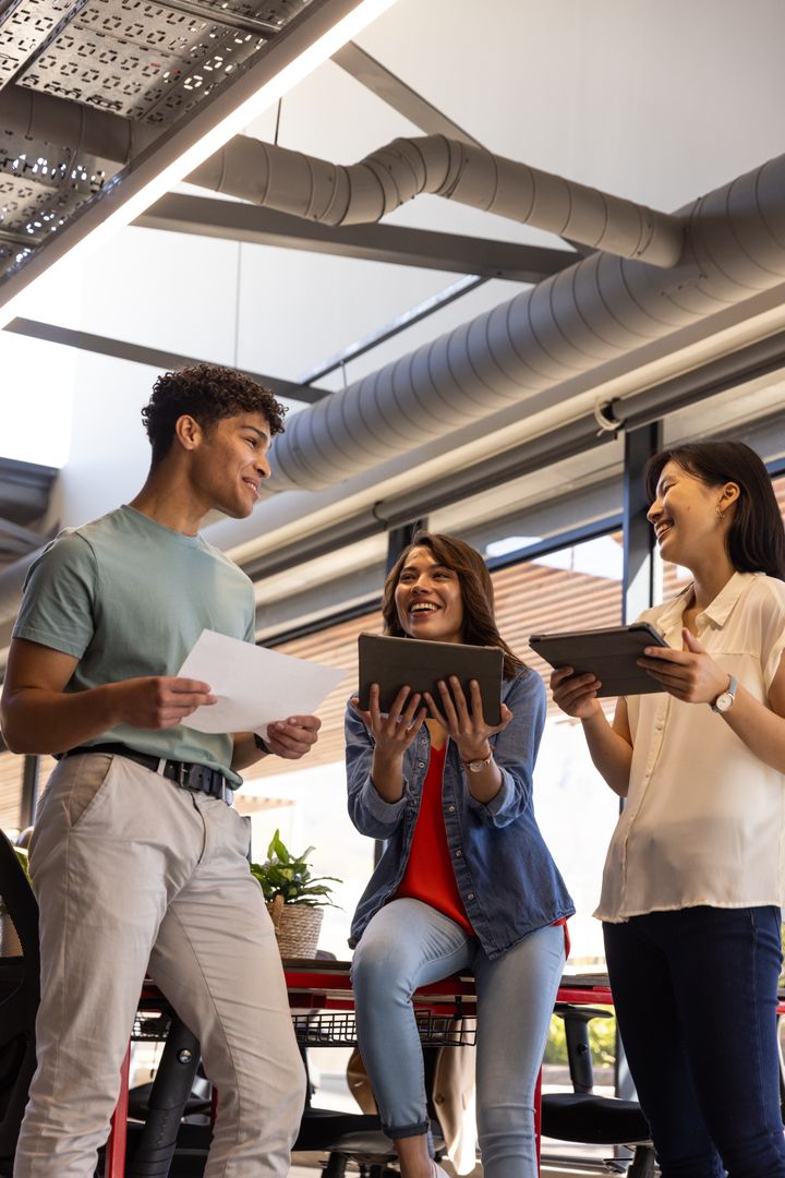 Diverse Team Collaborating Around Central Office Table