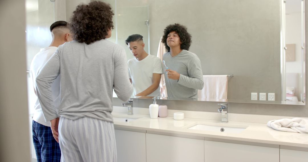 Roommates Practicing Morning Hygiene in Modern Bathroom