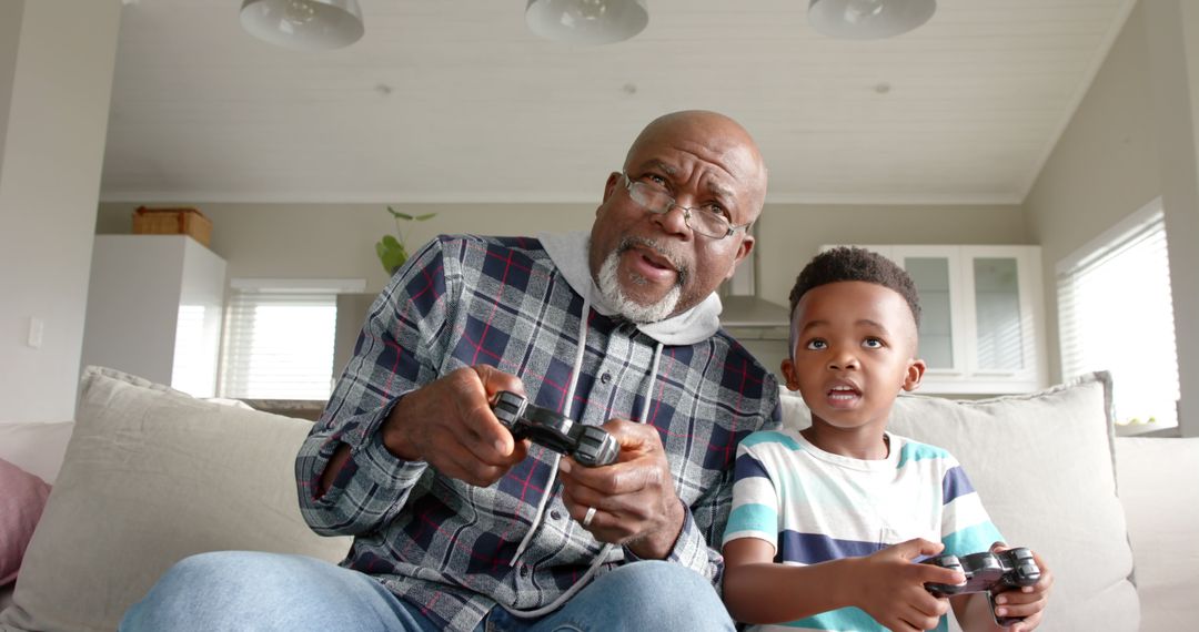 Grandfather and Grandson Bonding Over Video Games - Free Images, Stock Photos and Pictures on Pikwizard.com