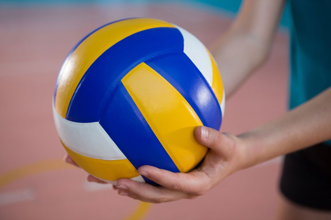 Close-up of Female Player Holding Volleyball in Court - Free Images, Stock Photos and Pictures on Pikwizard.com