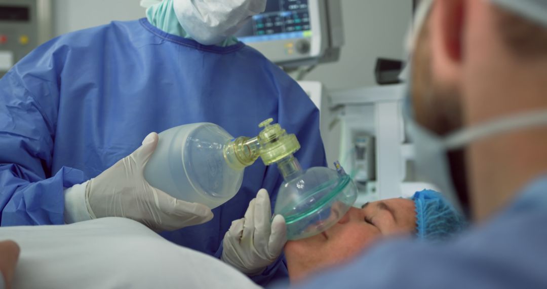 Doctor administers oxygen through mask in hospital setting - Free Images, Stock Photos and Pictures on Pikwizard.com