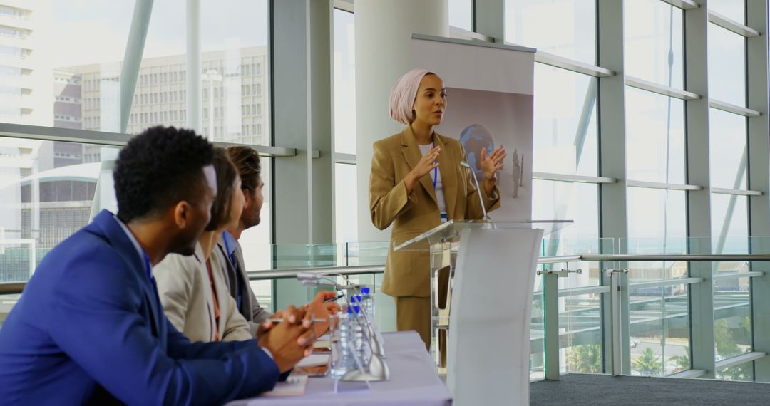 Diverse Team Attending Presentation in Modern Office