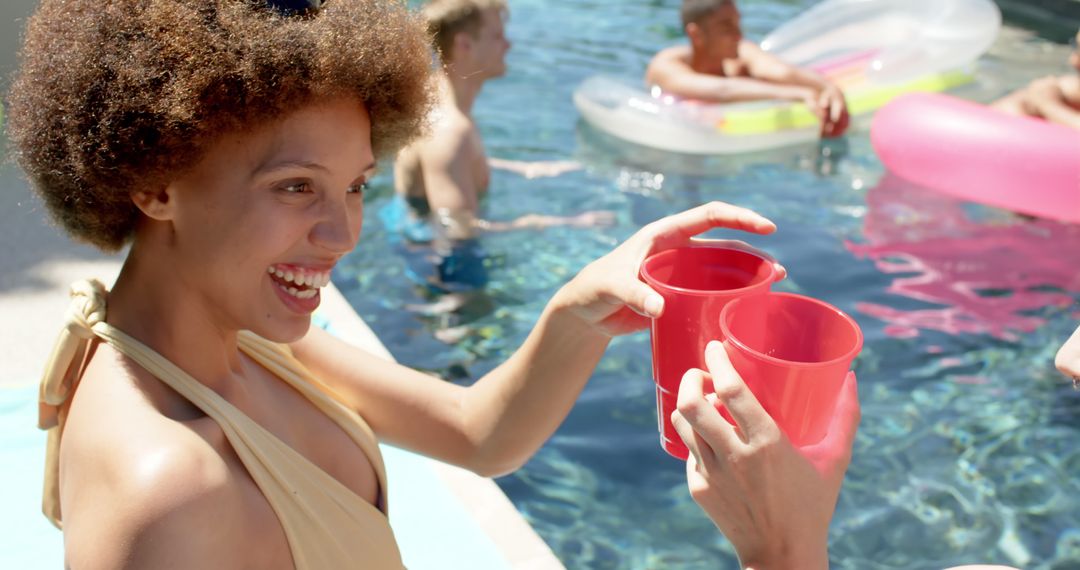 Friends Enjoying Refreshing Drinks at Pool Party - Free Images, Stock Photos and Pictures on Pikwizard.com