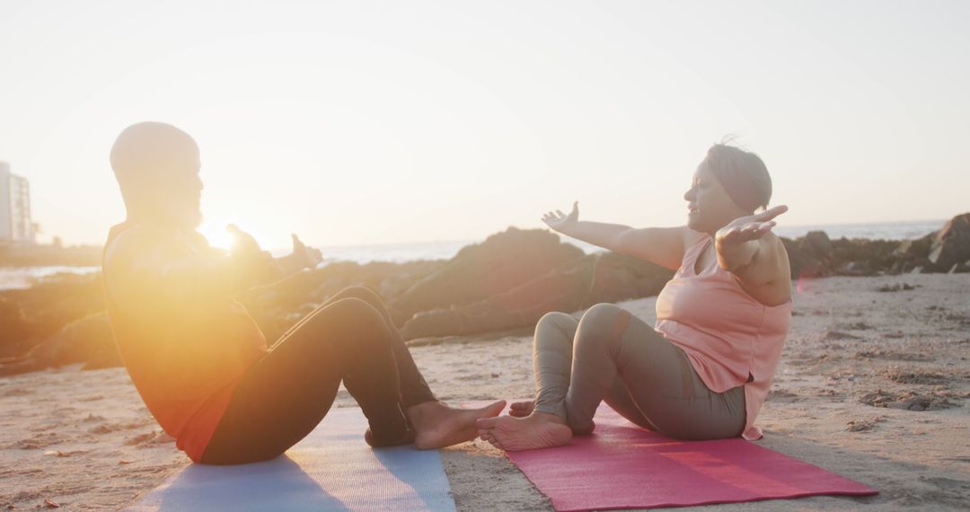 Couple Practicing Yoga on Beach During Sunset - Free Images, Stock Photos and Pictures on Pikwizard.com