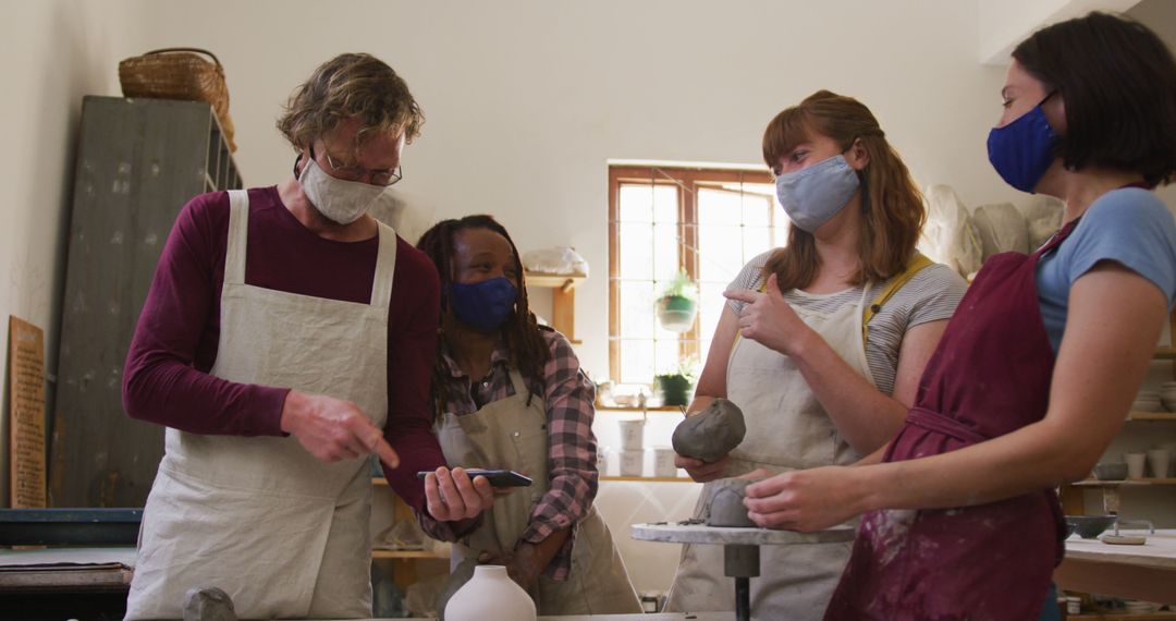 Group of Diverse Pottery Students Socializing in Studio - Free Images, Stock Photos and Pictures on Pikwizard.com