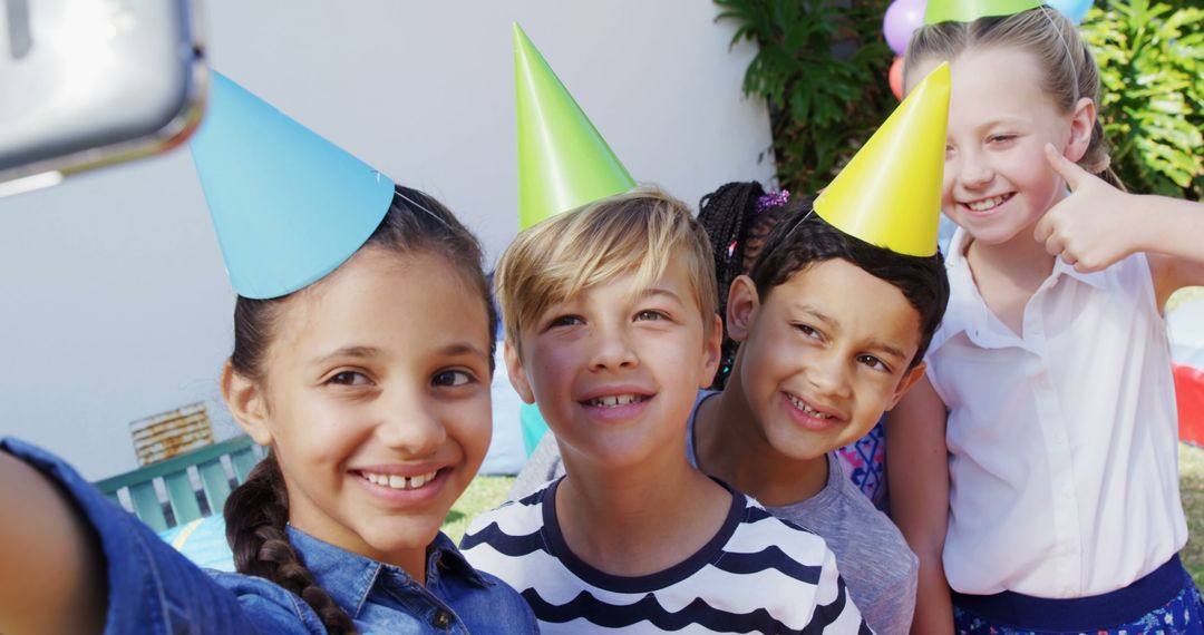 Joyful Children Taking Selfie at Outdoor Birthday Party - Free Images, Stock Photos and Pictures on Pikwizard.com