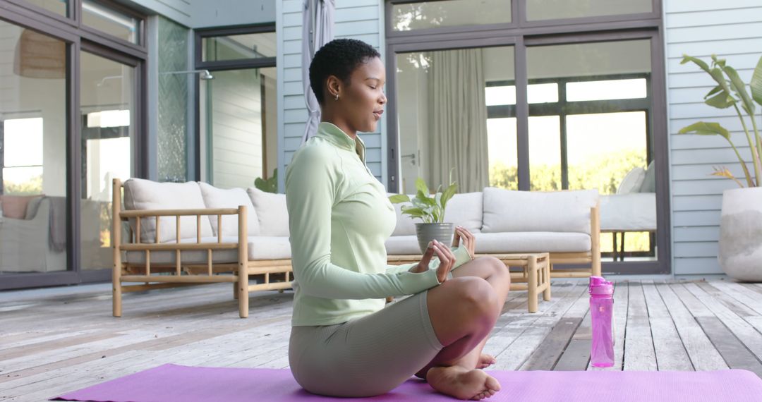 Woman Meditating on Patio in Morning Sunlight - Free Images, Stock Photos and Pictures on Pikwizard.com