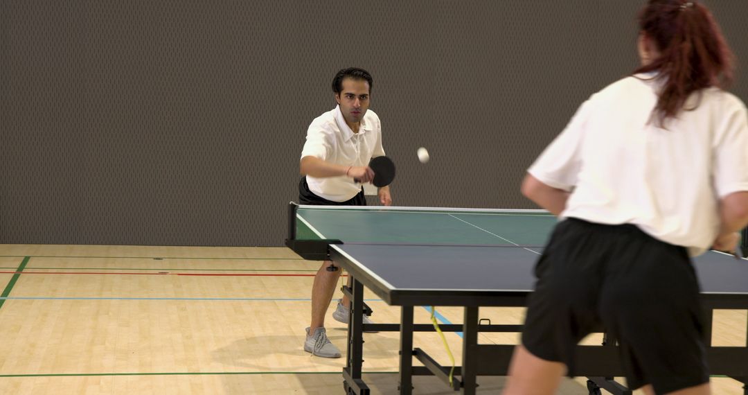 Dynamic Table Tennis Players Energized in Exciting Match