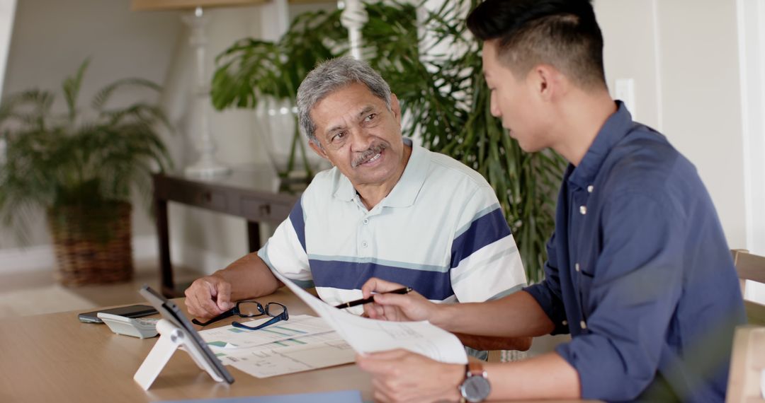 Financial Advisor Assisting Senior Client with Investment Planning