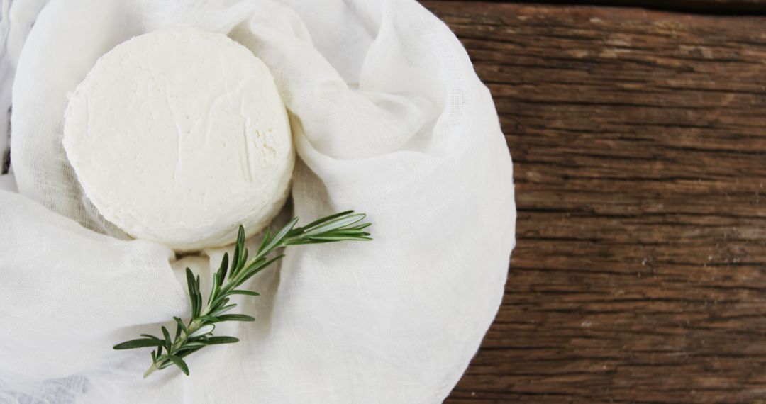 Fresh Homemade Cheese Wheel Wrapped in Cloth with Rosemary - Free Images, Stock Photos and Pictures on Pikwizard.com