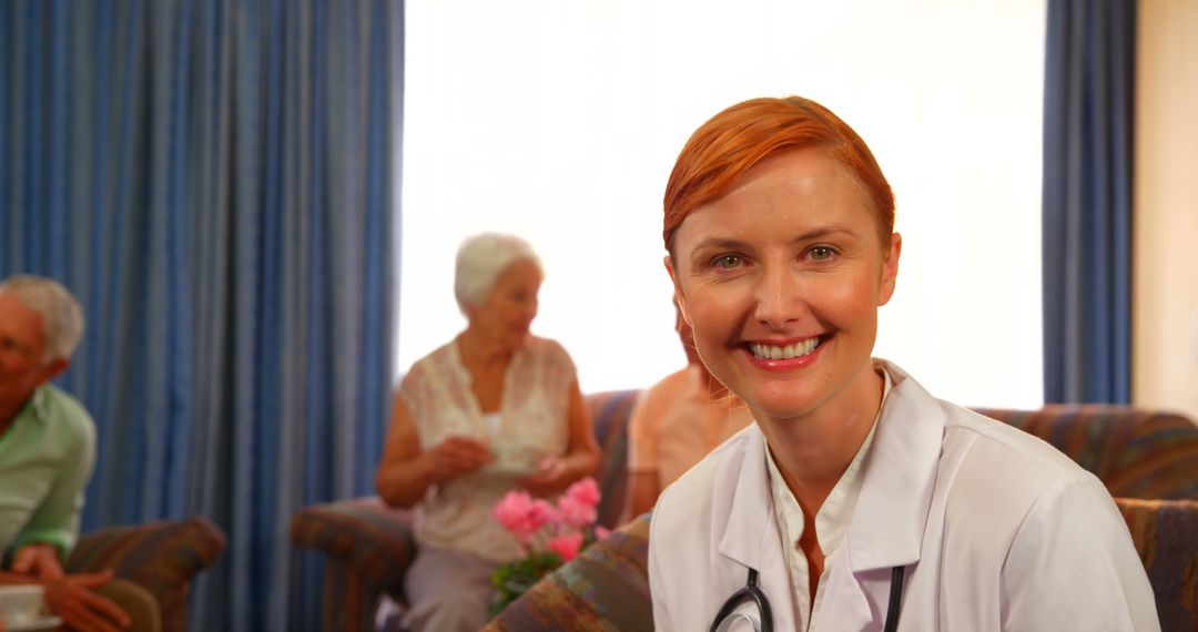 Smiling Redhead Nurse with Senior Patients in Background - Free Images, Stock Photos and Pictures on Pikwizard.com