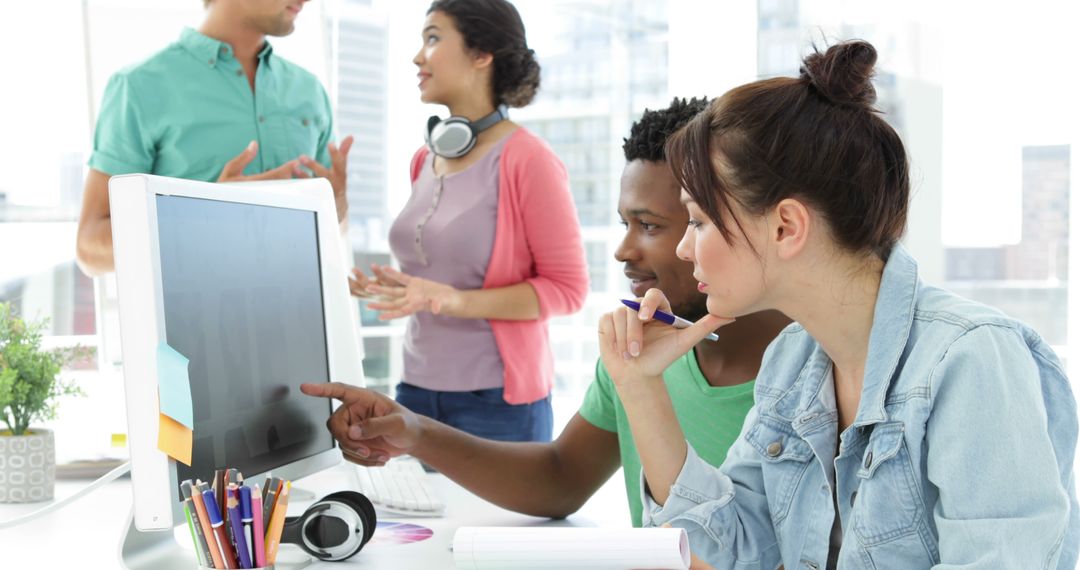 Collaborative Team Working on Design Project in Modern Office