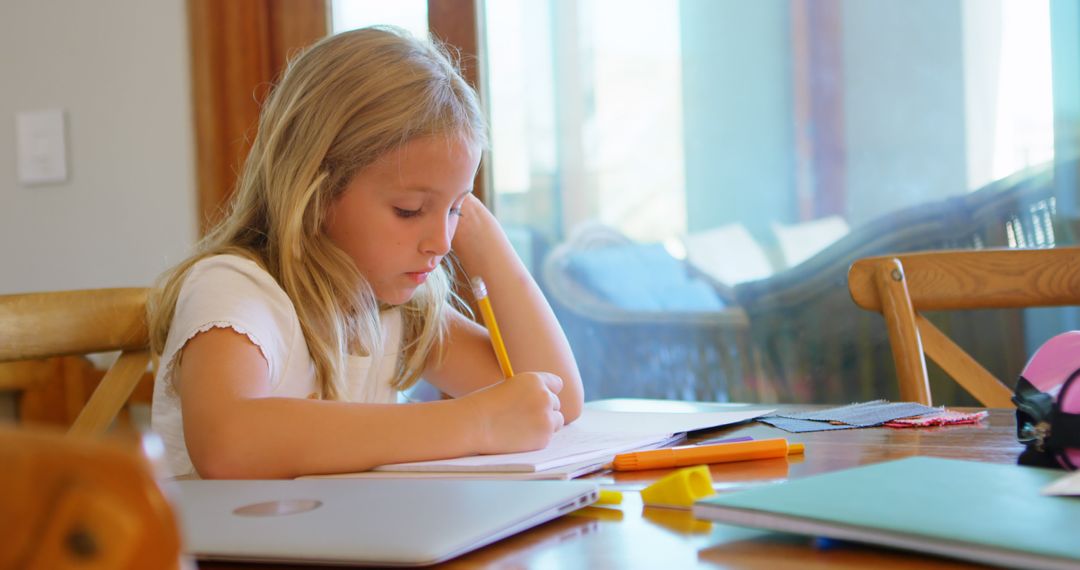 Young Girl Writing in Notebook at Home - Free Images, Stock Photos and Pictures on Pikwizard.com