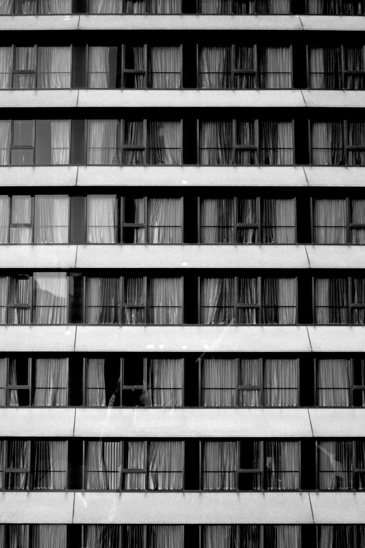Rows of Identical Window Facades in Urban Building - Free Images, Stock Photos and Pictures on Pikwizard.com