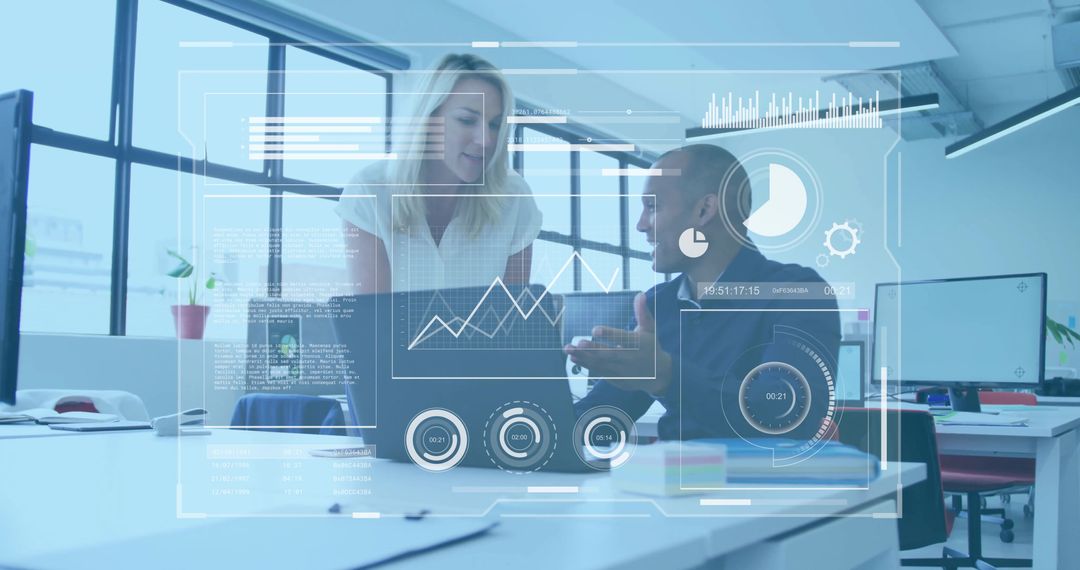 Coworkers Collaborating over Laptop with Augmented Data Dashboard in Modern Office