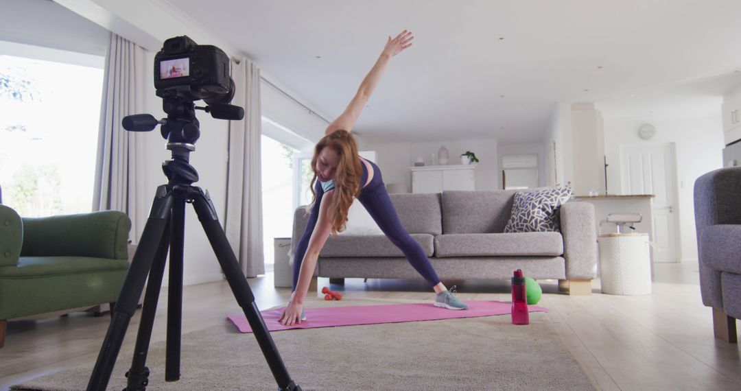 Woman Filming Workout Routine at Home for Online Fitness Vlog - Free Images, Stock Photos and Pictures on Pikwizard.com