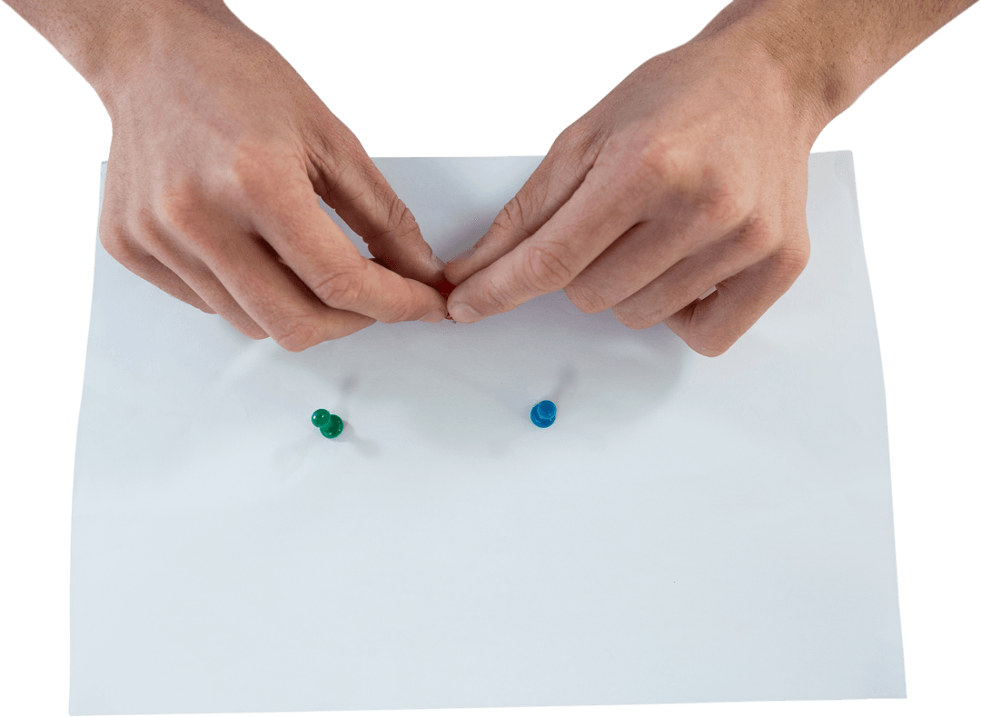 Hands Pinning Notes on White Paper with Transparent Push Pins
